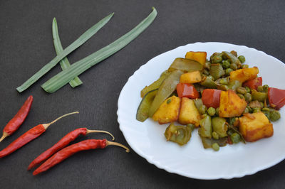 High angle view of vegetables in plate on table