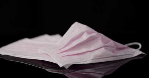 Close-up of crumpled paper against black background