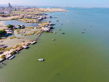 High angle view of sea and city