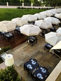 High angle view of chairs and tables at lawn