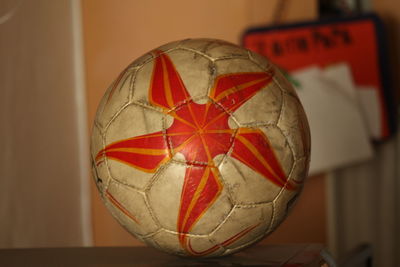 Close-up of red ball on table