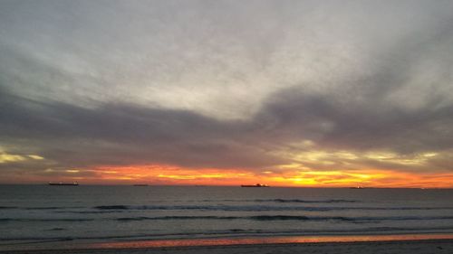 Scenic view of sea against cloudy sky