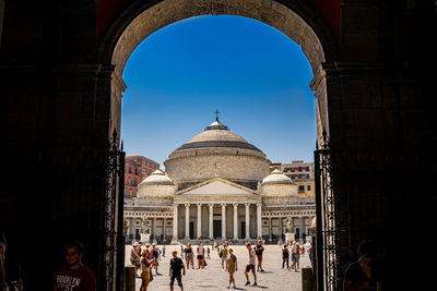 Group of people in front of historical building