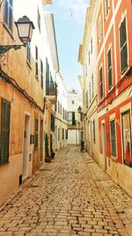 Narrow alley amidst residential buildings