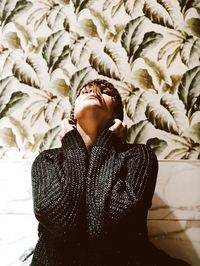 Young woman looking up