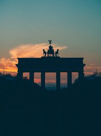 Silhouette of monument at sunset