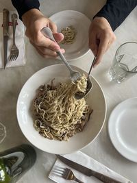 Cropped hand of person preparing food