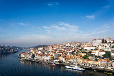 View of cityscape against blue sky