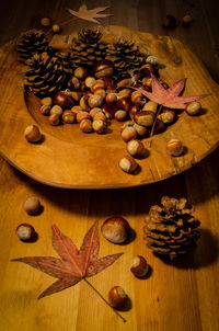 High angle view of fruits and leaves on table