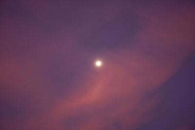 Low angle view of moon against sky at night