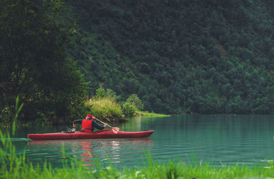 People kayaking in lake