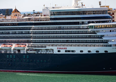 View of ship in city against sky