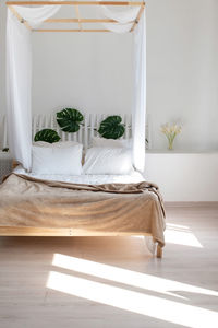 Cozy bright bedroom in white and beige colors. the interior is in the style of minimalism.