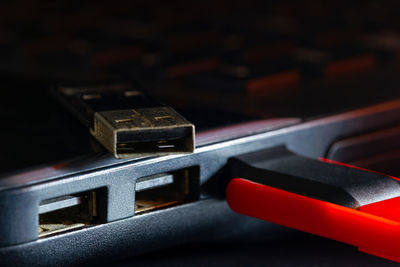 Close-up of usb stick attached to laptop