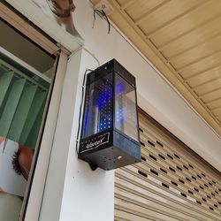 Low angle view of illuminated lighting equipment at home