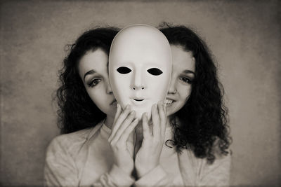 Multiple images of young woman holding mask