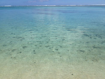 Scenic view of sea against blue sky