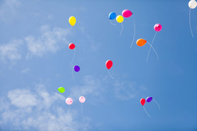 Low angle view of balloon against blue sky