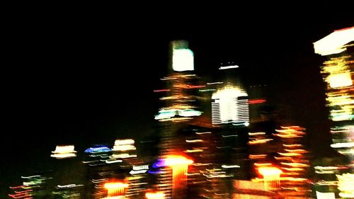 Illuminated buildings in city at night