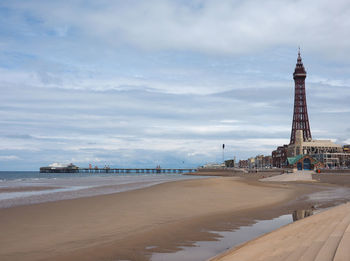 View of beach against cloudy sky