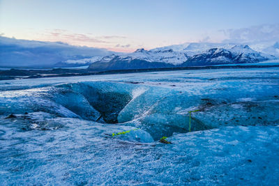 Scenic view of frozen sea against sky