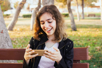 Young woman using mobile phone