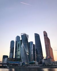 Low angle view of skyscrapers against clear sky