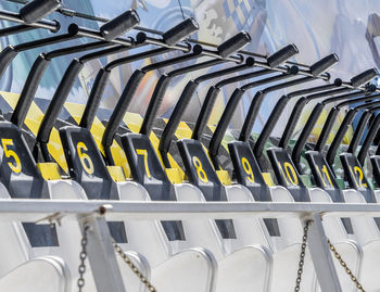 Close-up of chairs in row