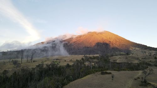 Scenic view of mountains against sky during sunset