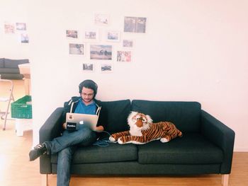 Portrait of young man relaxing on sofa