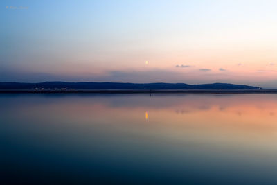 Scenic view of sunset over river