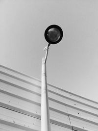 Low angle view of street light against sky