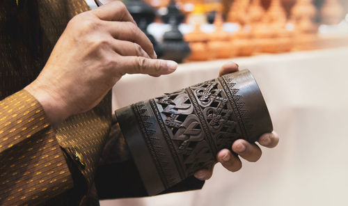 Close-up of hand holding paper