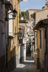 Alley amidst buildings in city