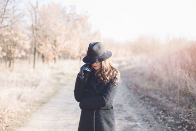 Close-up of beautiful woman on road