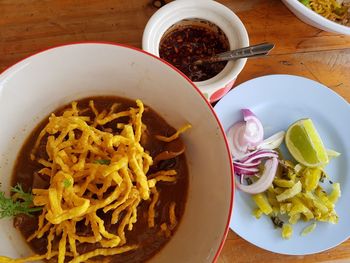 High angle view of meal served on wooden table