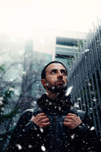 Portrait of a young guy going into the snow