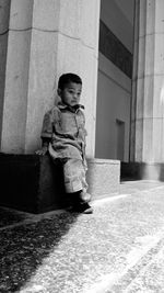 Full length of girl standing by staircase