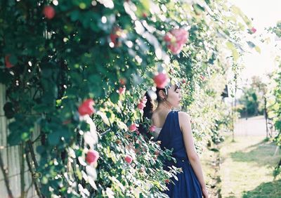 Woman standing on tree