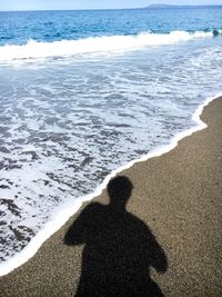 Shadow of man on beach