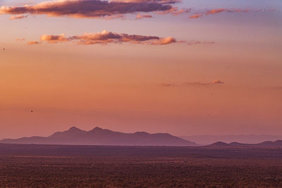 Scenic view of mountains against sky during sunset