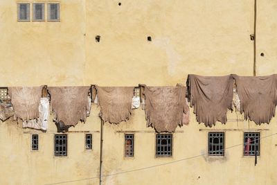 Textile drying on railing of building