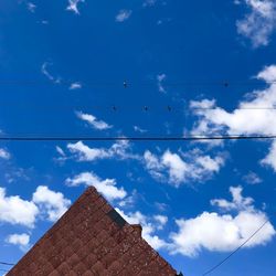 Low angle view of building against blue sky