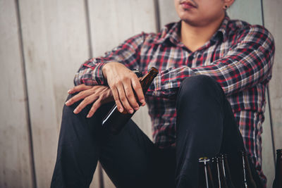 Full length of woman using mobile phone