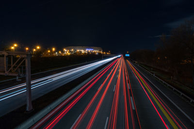 High angle view of light trails on highway at night