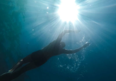 Low angle view of person swimming in sea