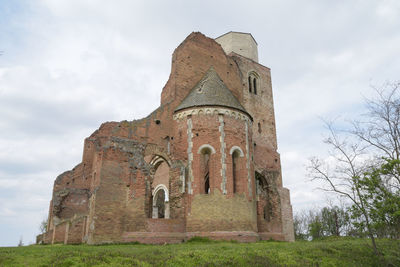 Low angle view of old building against sky