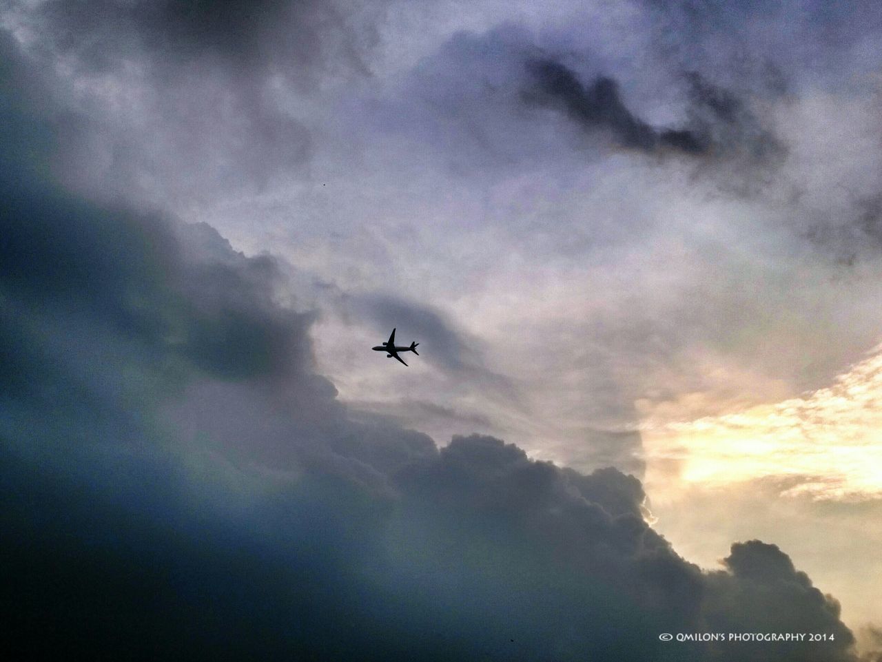 airplane, air vehicle, mode of transport, transportation, flying, sky, cloud - sky, cloudy, mid-air, low angle view, public transportation, travel, on the move, weather, journey, silhouette, dusk, overcast, commercial airplane, nature