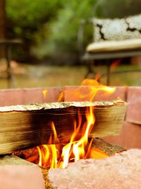 Close-up of burning fire on wood