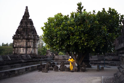 View of temple against building